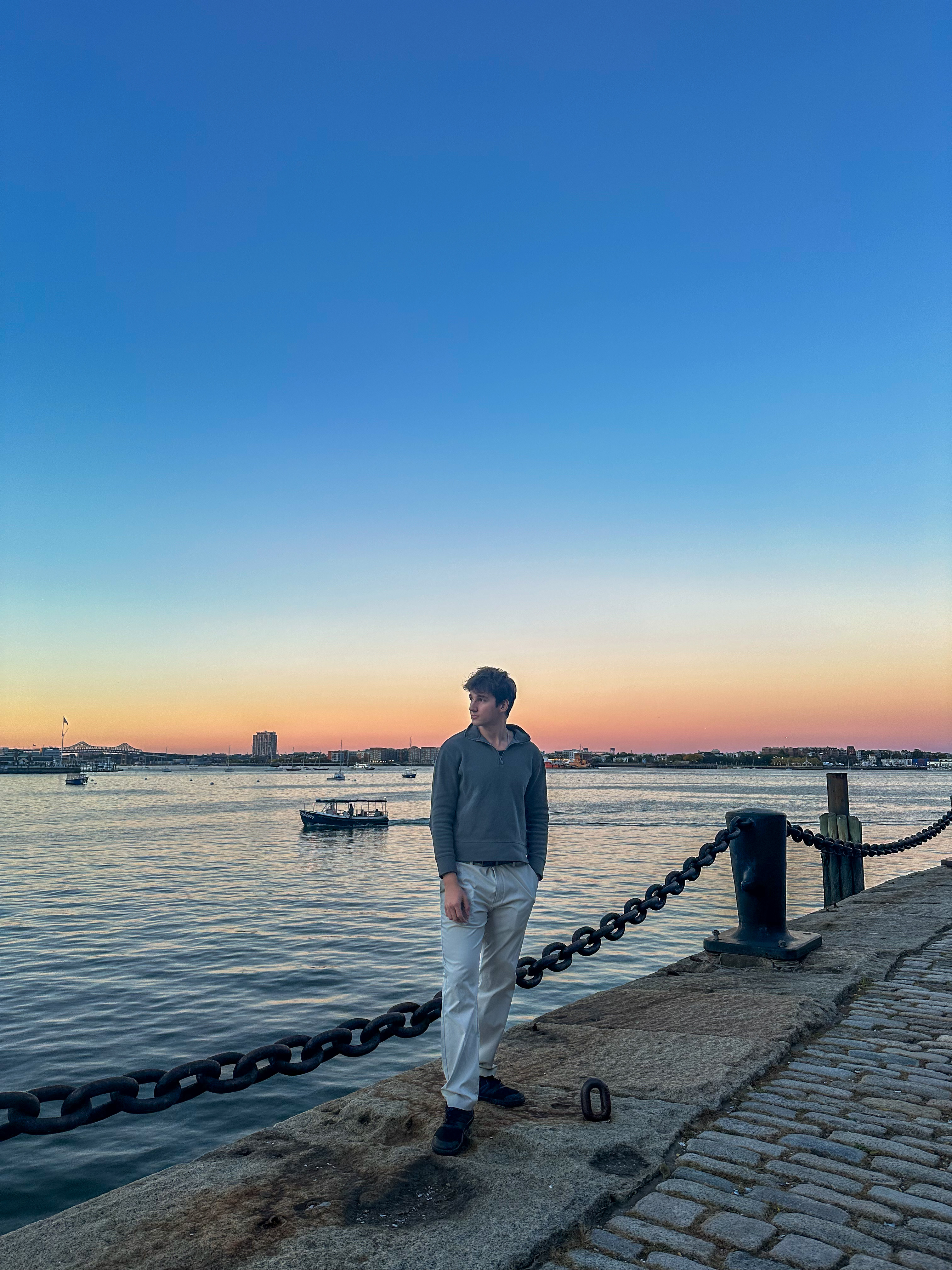 Denis Borta by the waterfront at sunset